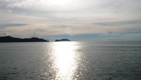 A-beautiful-calm-sea,-with-a-sunny-reflection-Slowmo