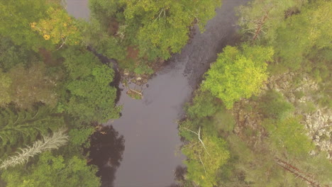 Beautiful-drone-footage-of-a-hut-and-a-rapid-in-borealis-river