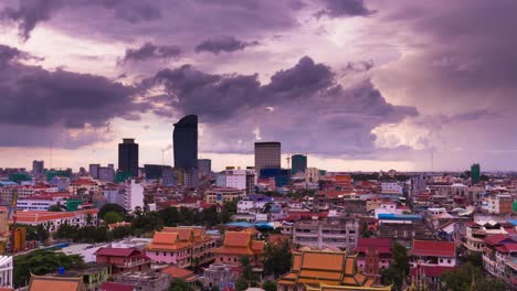 Phnom-Penh-Cityscape---clouds---old-and-new-with-pagodas-in-foreground