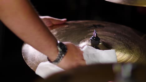 Close-up-of-a-person-cleaning-a-drum-kit-cymbal
