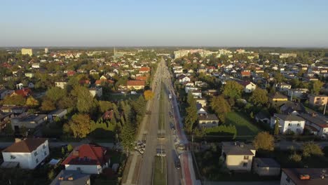 Aerial-shot-of-a-road-under-construction-in-small-european-town-during-sunset
