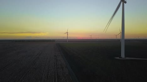 Beautiful-sunset-backdrop-behind-wind-farm
