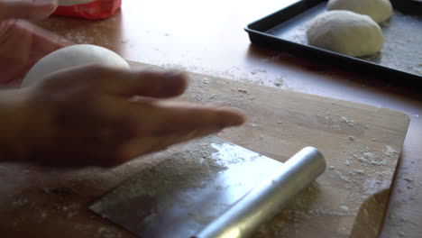 Chef-preparing-dough-for-pizza,-croissants-or-bread