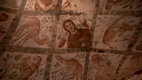 Rotating-Shot-of-Dome-Ceiling-Fresco-of-a-Man-and-Animals-Inside-Qasr-Amra-Desert-Castle