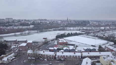 Push-forward-drone-shot-of-a-snowy-Exeter-looking-towards-the-town-centre-over-the-River-Exe-CROP