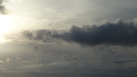 Timelapse-of-an-aircraft-followed-by-dark-stormy-clouds-while-night-comes