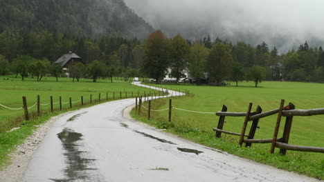 Rainy-day-in-Alpine-valley-with-low-clouds,-Logarska-dolina,-Slovenia,-European-Alps,-bad-travel-weather,-hiking-in-mountains,-HD