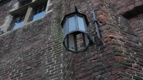 Lamp-hanging-on-castle-wall