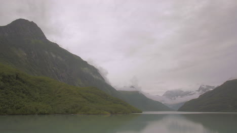 Alaskan-Reservoir-with-Clouds-Forming