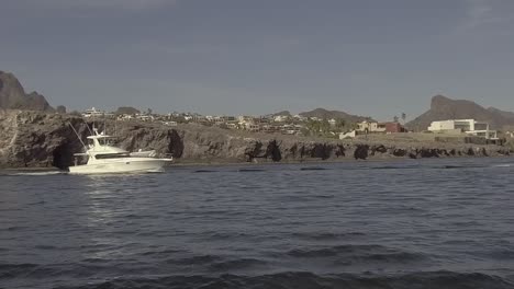Slow-motion-gimbaled-shot-of-yacht-leaving-San-Carlos-in-Sea-of-Cortez