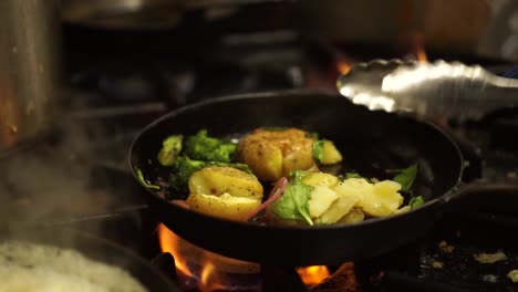 SLOWMO---Close-Up---Frying-steamed,-fresh,-green-broccoli,-spinach,-onion-and-potatoes-on-a-fire