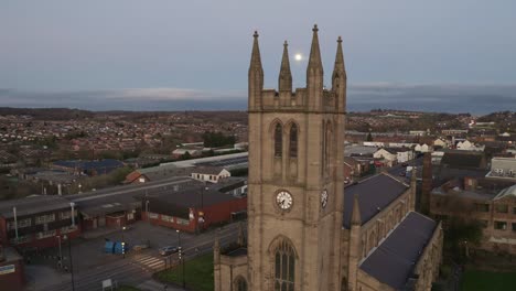 Aerial-view-of-St-Jame's-church-in-the-midlands,-Christian,-Roman-catholic-religious-orthodox-building-in-a-mainly-muslim-area-of-Stoke-on-Trent-in-Staffordshire,-City-of-Culture
