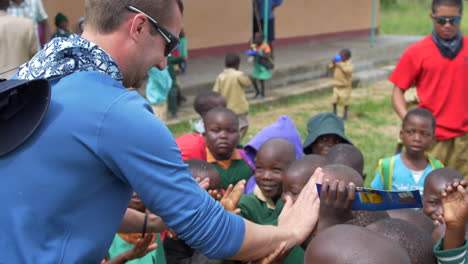 African-Children-Happily-Greet-a-White-Man-with-Enthusiastic-High-Fives