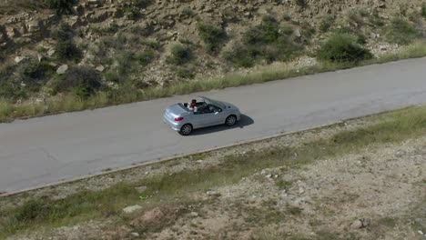 Drive-open-roof-car---aerial-tracking-slow-motion-shot