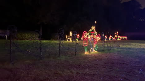 Night-shot-of-Christmas-lights-of-elves-on-a-wheelbarrow