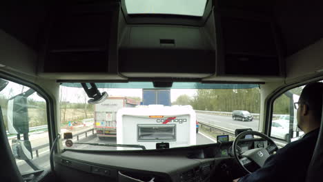 In-cab-view-of-a-HGV-driver-in-a-queue-of-traffic-on-the-M1-motorway-caused-due-to-an-accident