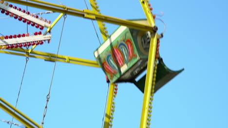 4k-of-a-Ferris-Wheel-Amusement-Ride-buckets-spinning-at-the-Fun-Fair