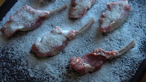 Dry-Ageing-Meat,-Chef-Preparing-lamb-chops-for-dry-aging,-salting-process