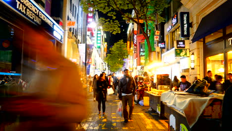 Seoul,-South-Korea,-Circa-â€“-Night-shoppers-visit-Myeongdong-district,-shopping-and-tasting-street-food
