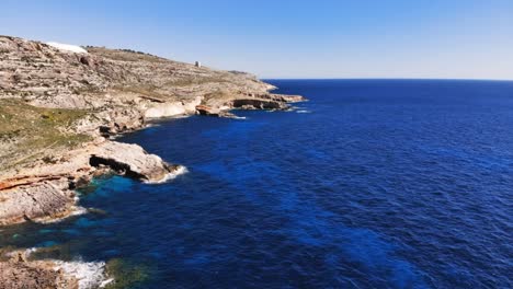 Aerial-drone-hyperlapse-video-from-Malta,-Siggiewi,-Ghar-Lapsi-area-on-a-sunny-spring-day