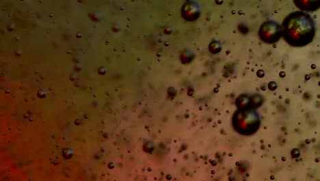 Blasen,-Die-Zu-Einer-Zähen-Substanz-Mit-Farbigem-Hintergrund-Aufblasen