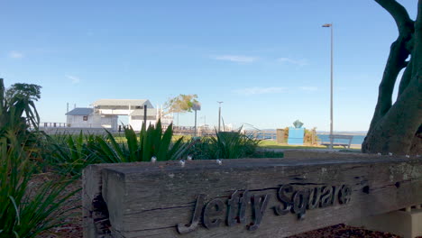 Jetty-Square-sign-with-Woody-Point-Jetty-in-the-background-on-a-cold-sunny-morning