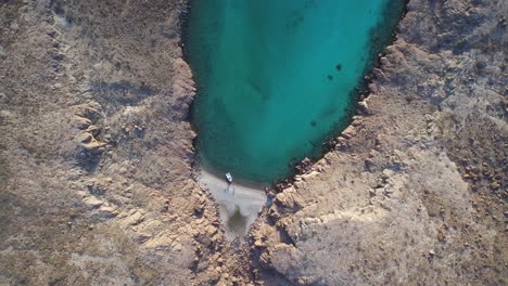 Aerial-cenital-plane-shot-of-a-very-little-beach-in-Partida-Island,-Archipielago-Espritu-Santo-National-Park,-Baja-California-Sur