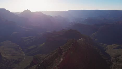 Drone-flying-in-Grand-Canyon,-beautiful-aerial-view-at-sunrise