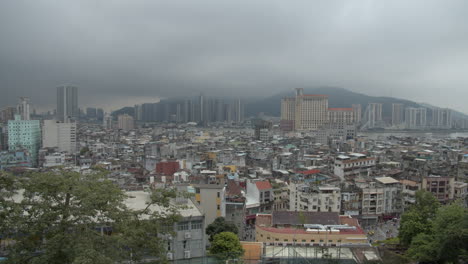 Cityscape-view-of-Macau-old-buildings-district-from-Mount-Fortress-on-a-gray-overcast-cloudy-day,-Macau-SAR,-China