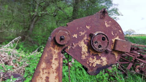Slow-pan-shot-of-discarded-farm-equipment