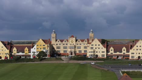 Tight-aerial-profile-view-of-Roedean-School,-situated-on-the-Chalk-cliffs-near-Brighton,-UK