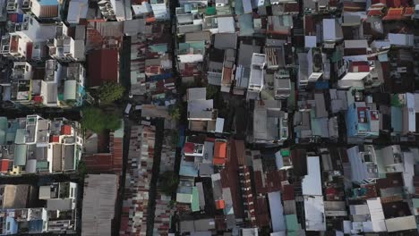 Morning-Drone-Flight-looking-straight-down-over-modern-High-density-housing-and-terrace-houses-in-middle-class-area-of-Ho-Chi-Minh-City-in-Vietnam