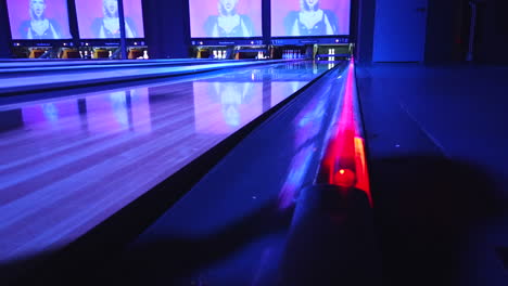 A-failed-shot-at-executing-a-strike-during-neon-night-at-the-local-bowling-alley