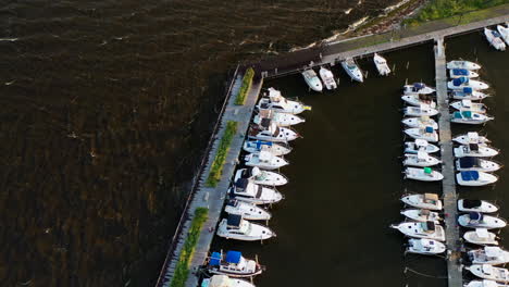tilt-down-pan-over-the-boats-on-the-pier-at-East-Islip-Marina---Park-at-sunset-on-a-very-windy-evening