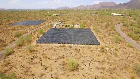 Aerial-rapid-push-in-on-an-array-of-solar-panels-in-the-Sonoran-desert-near-Taliesin-West,-Scottsdale,-Arizona-Concept:-environment,-alternative-energy,-solar-power