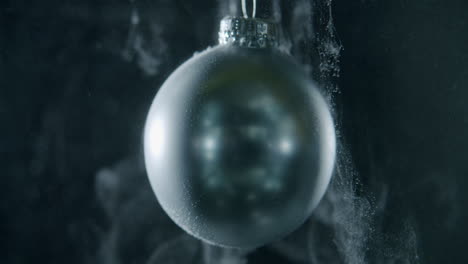 Xmas-bauble-floating-on-a-dark-background