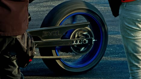 Slow-motion-shot-of-spinning-wheels-of-motorcycle,close-up-shot