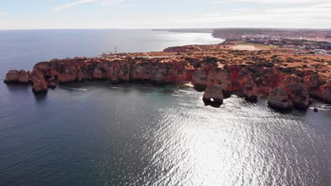 Amazing-aerial-shot-above-lagos-cliff-meeting-the-open-ocean