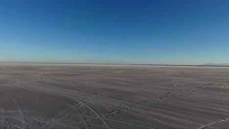 Flying-over-the-Bonneville-Salt-Flats-in-Northwestern-Utah-reveal-white-salt-and-tire-tracks