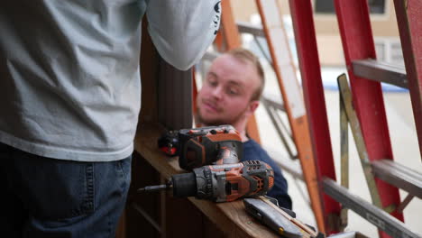 A-crew-of-men-construction-workers-framing-and-building-a-tiny-house