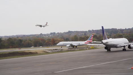 Airplanes-lining-up-for-take-off-as-a-plane-comes-in-for-a-landing-at-John-Glenn-International-Airport-in-Columbus-Ohio