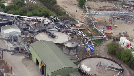 Aerial-view-of-Paper-Pulp-tanks-at-DS-Smith,-Kemsley-Paper-Mill,-in-Kemsley,-Kent,-UK