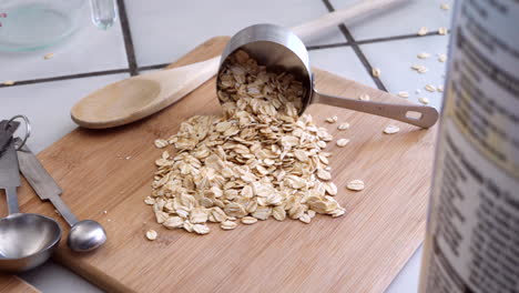 A-pile-of-oats-grain-cereal-with-kitchen-utensils-for-a-healthy-oatmeal-breakfast