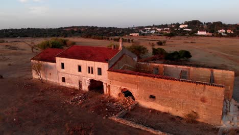 Parallax-View-Of-Dismantling-The-Old-House-in-In-Albufeira,-Portugal-During-Sunset