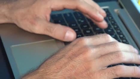 Close-Shot-of-Male-Hands-Typing-on-a-Laptop-Computer