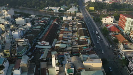Early-morning-aerial-view-pushing-in-on-the-Thi-Nghe-Market-and-bridge-over-the-Hoang-Sa-canal-in-Binh-Thanh-district-of-Ho-Chi-Minh-City