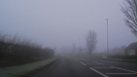 POV-dashboard-driving-in-British-fog-weather-urban-road-traffic