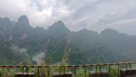 Bus-window-view-of-the-dangerous-winding-road-of-99-turns-to-the-top-of-the-Tianmen-Mountain-on-a-monsoon-rainy-day,-Zhangjiajie-National-Park,-Hunan,-China