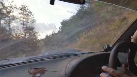 Intense-Action-Shot-from-Inside-a-Drifting-Car-on-a-Curvy-Road