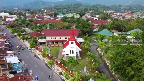 Aerial-over-Old-church-at-Palopo-city,-Aerial-over-PNIEL-Palopo